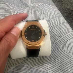 Assouline Black and Gold Timepiece